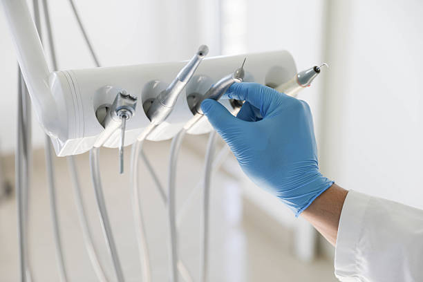 Professional Tooth Extraction technician working in Buncombe County County, NC